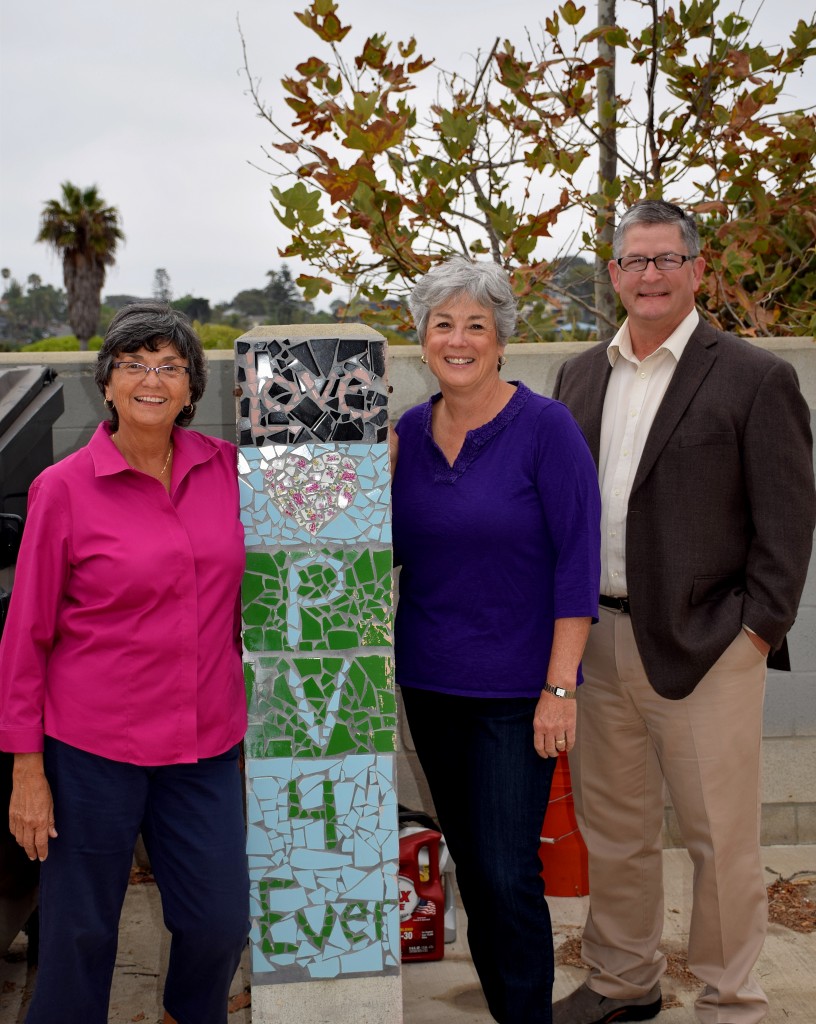 Councilmembers and Pacific View allies Teresa Barth, Lisa Shaffer and Tony Kranz pose by a mosaic on the Pacific View property.